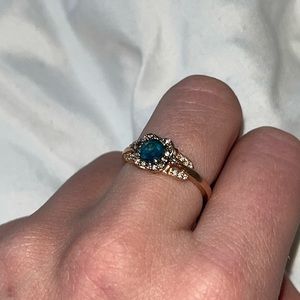 Gold Ring with Teal Blue Center Stone and Halo Accents